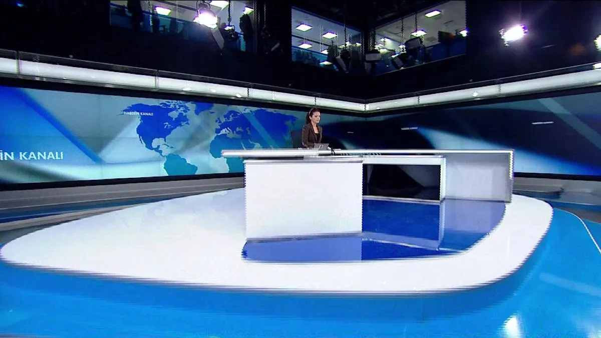 Modern news studio: Platform conveying current events. The News Studio incorporates Video Wall Graphic Designs, which consist of multiple screens within the set design. These designs are carefully crafted to ensure compatibility with other graphic elements such as the lower third and opener, creating a cohesive visual experience.